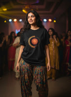 Young woman wearing Fire and Energy mandala print unisex black t-shirt bhajan clubbing India